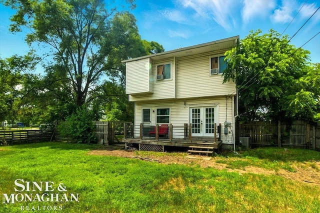 3032 24th St, Port Huron, MI 48060 - rear view of house with french doors, a wooden deck, and a fenced backyard