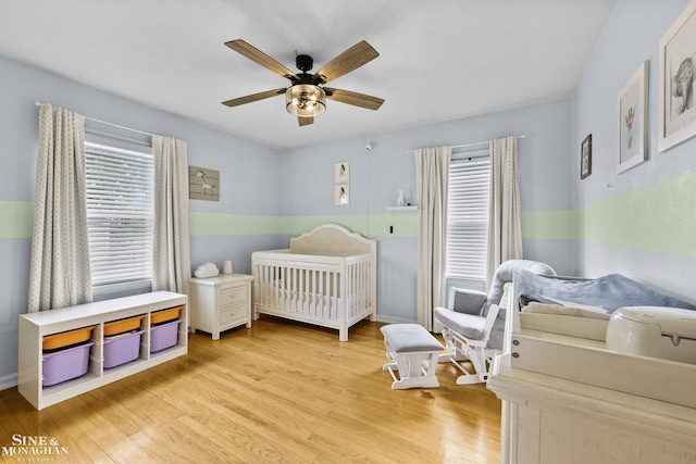 1857 Roslyn Rd, Grosse Pointe Woods, MI 48236 - bedroom with multiple windows, light wood-type flooring, a nursery area, and ceiling fan
