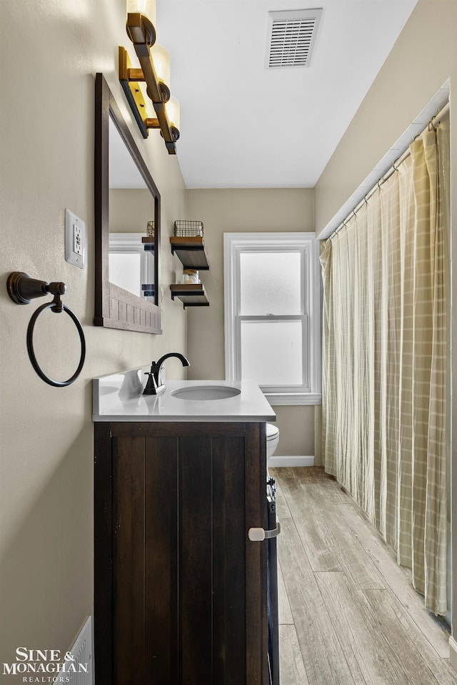 1857 Roslyn Rd, Grosse Pointe Woods, MI 48236 - bathroom with vanity, wood finished floors, and a shower with shower curtain