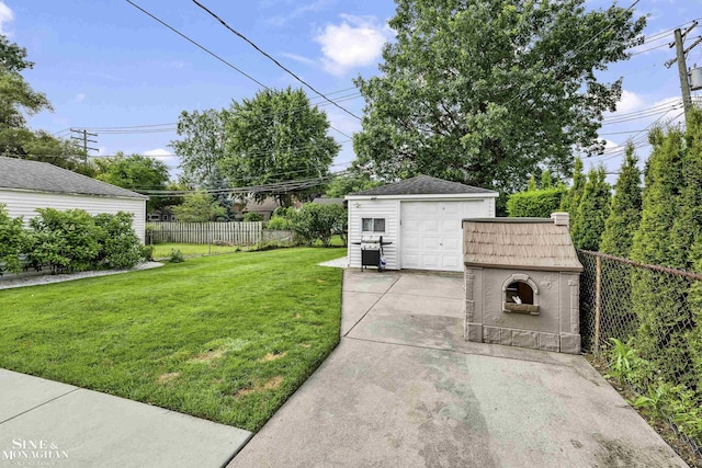 1857 Roslyn Rd, Grosse Pointe Woods, MI 48236 - view of yard featuring driveway, an outdoor structure, and a garage