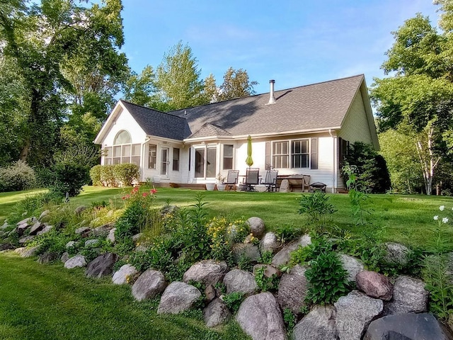 2308 S River Rd, Beaverton, MI 48612 - rear view of property featuring a lawn