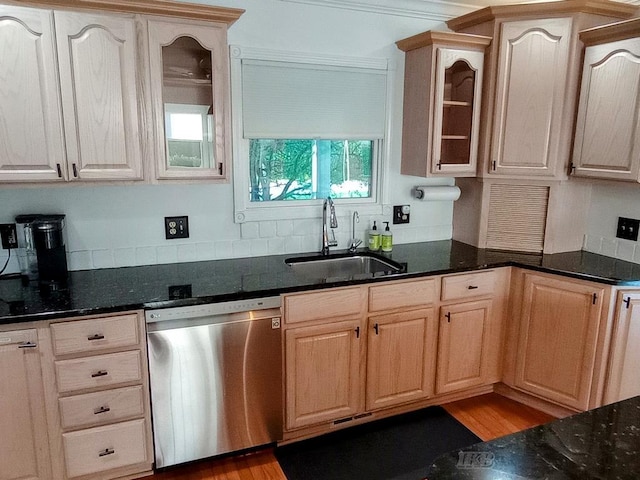 2308 S River Rd, Beaverton, MI 48612 - kitchen featuring stainless steel dishwasher, dark stone counters, glass insert cabinets, and backsplash