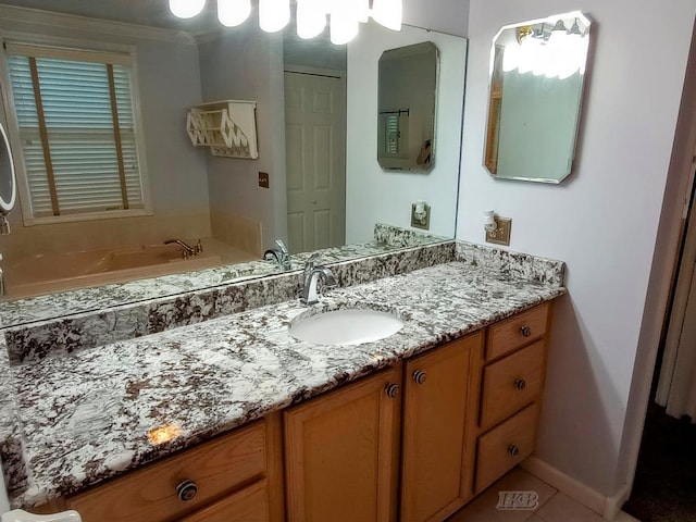 2308 S River Rd, Beaverton, MI 48612 - bathroom featuring vanity, a bath, and tile patterned flooring