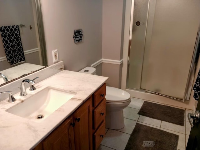 2308 S River Rd, Beaverton, MI 48612 - bathroom featuring a shower stall, vanity, and tile patterned floors