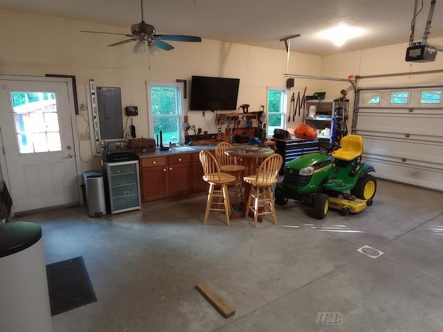 2308 S River Rd, Beaverton, MI 48612 - garage featuring wine cooler, electric panel, and ceiling fan