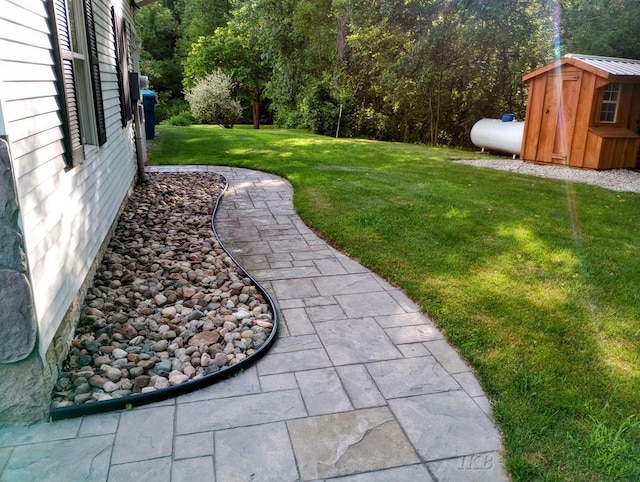 2308 S River Rd, Beaverton, MI 48612 - view of green lawn featuring a storage shed