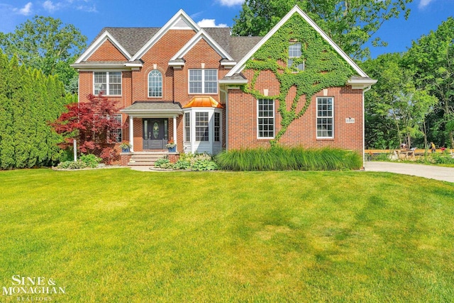 3325 Saint Andrews Dr, Port Huron, MI 48060 - view of front of house featuring a front yard and brick siding