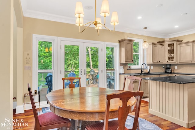 3325 Saint Andrews Dr, Port Huron, MI 48060 - dining space featuring light wood finished floors, ornamental molding, a chandelier, and recessed lighting