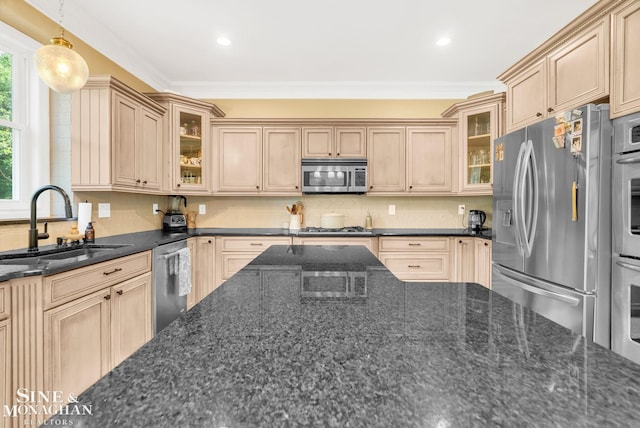 3325 Saint Andrews Dr, Port Huron, MI 48060 - kitchen with stainless steel appliances, backsplash, glass insert cabinets, decorative light fixtures, and ornamental molding