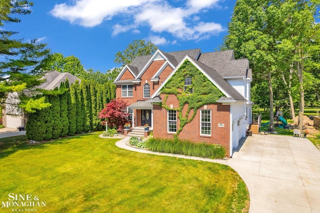 3325 Saint Andrews Dr, Port Huron, MI 48060 - view of front of home featuring driveway, brick siding, a front lawn, and a shingled roof