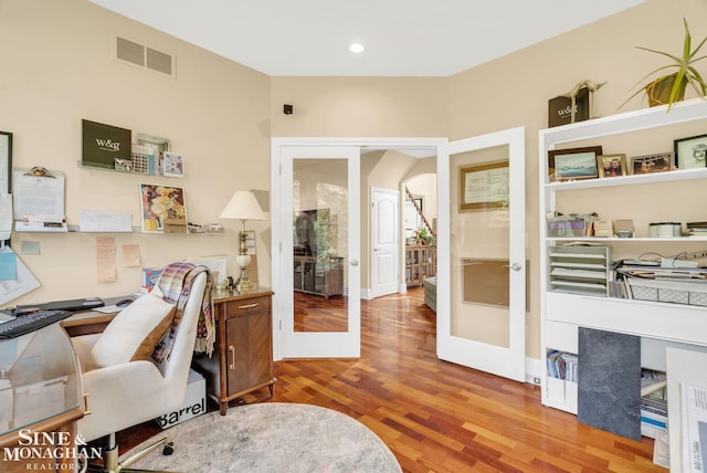 3325 Saint Andrews Dr, Port Huron, MI 48060 - office area featuring french doors, wood finished floors, arched walkways, and recessed lighting