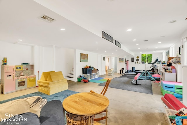 3325 Saint Andrews Dr, Port Huron, MI 48060 - playroom with finished concrete flooring and recessed lighting