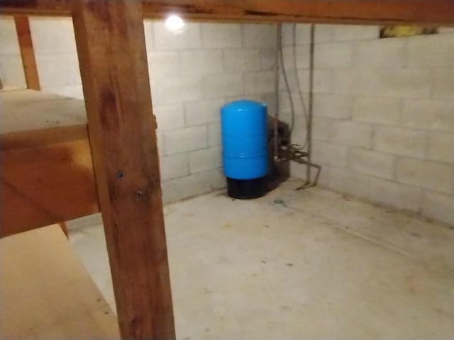 11374 S Shore Dr, Lake, MI 48632 - unfinished basement featuring a water pressure tank