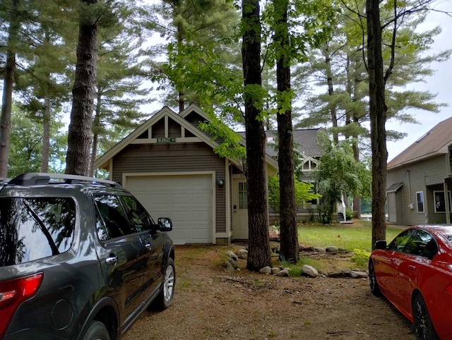 11374 S Shore Dr, Lake, MI 48632 - garage featuring driveway