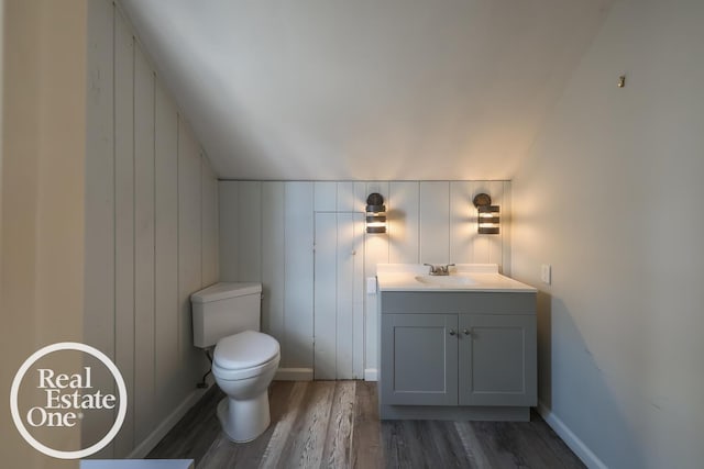 491 Bournemouth Rd, Grosse Pointe Farms, MI 48236 - half bath with wood finished floors, vanity, and vaulted ceiling