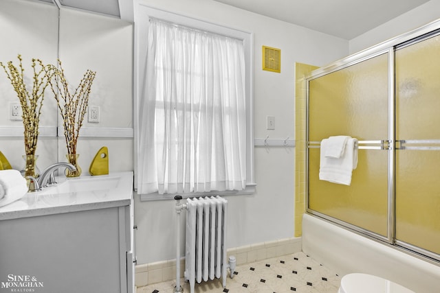 488 University Pl, Grosse Pointe, MI 48230 - bathroom featuring radiator, vanity, enclosed tub / shower combo, and tile patterned flooring