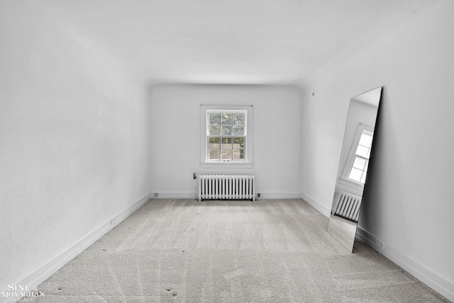 488 University Pl, Grosse Pointe, MI 48230 - carpeted empty room featuring radiator heating unit and baseboards