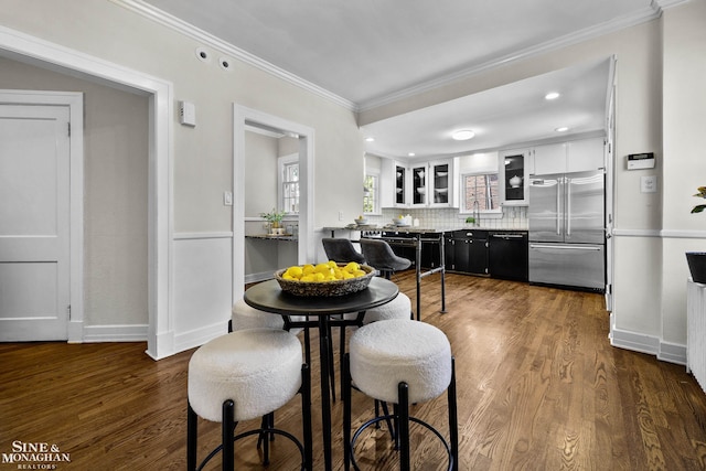 488 University Pl, Grosse Pointe, MI 48230 - dining room with dark wood finished floors, ornamental molding, and recessed lighting