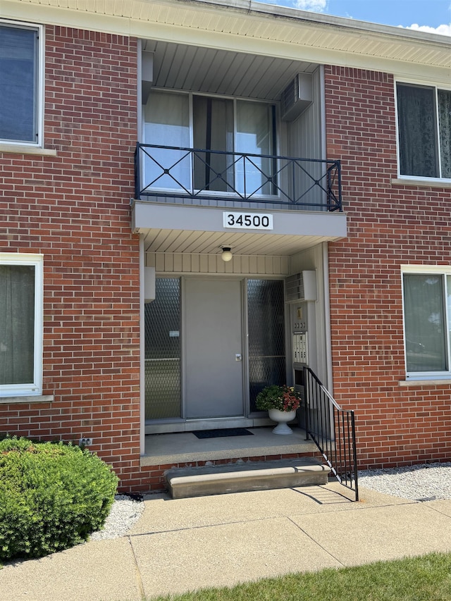 34500 Mulvey Rd, Fraser, MI 48026 - property entrance featuring a balcony and brick siding