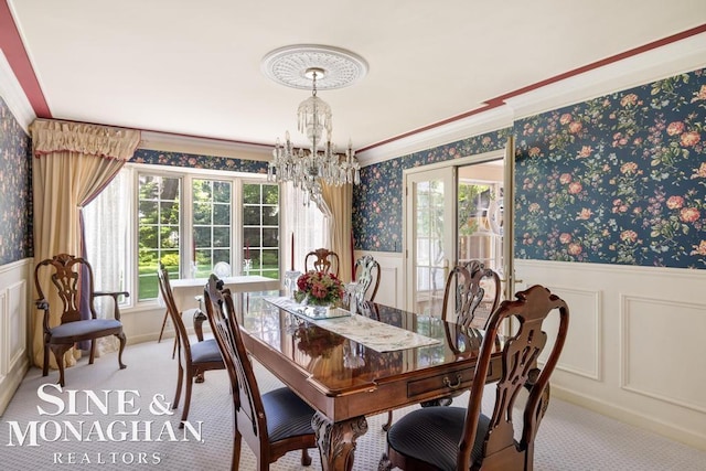 28 Hampton Rd, Grosse Pointe Shores, MI 48236 - dining area with a chandelier, wallpapered walls, wainscoting, light colored carpet, and a decorative wall