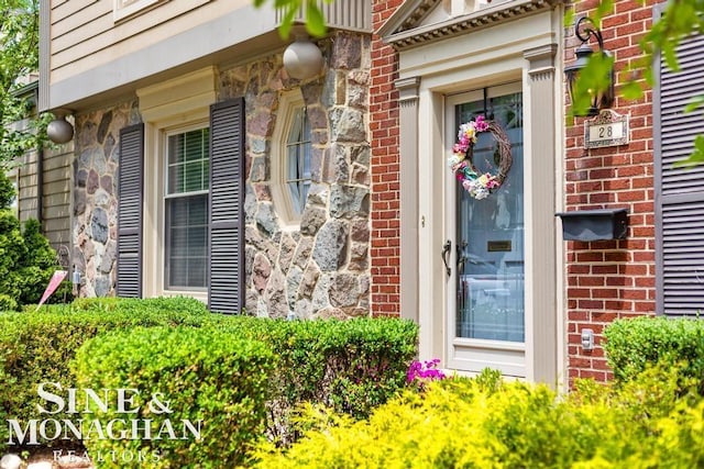 28 Hampton Rd, Grosse Pointe Shores, MI 48236 - view of exterior entry featuring brick siding and stone siding