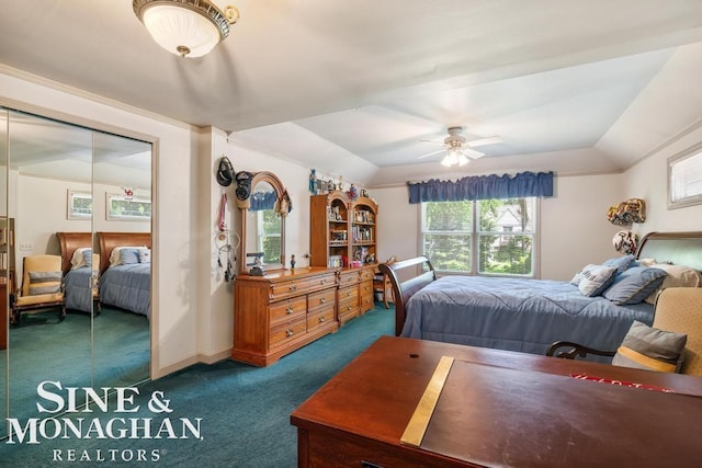 28 Hampton Rd, Grosse Pointe Shores, MI 48236 - bedroom with dark carpet, a tray ceiling, a closet, and a ceiling fan
