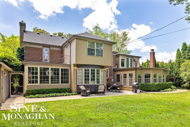 28 Hampton Rd, Grosse Pointe Shores, MI 48236 - rear view of property with a patio, a yard, and a chimney
