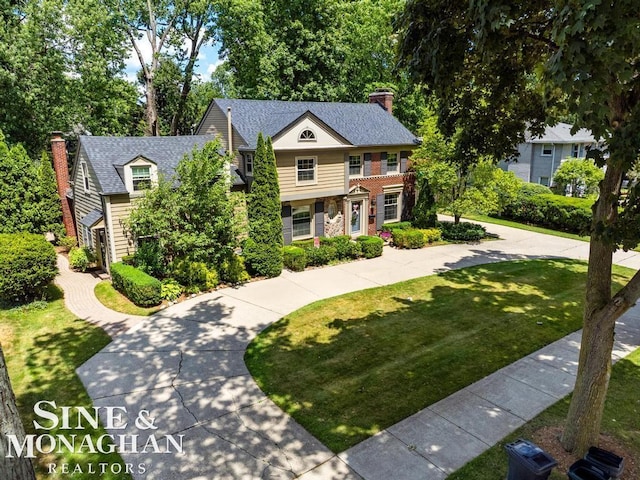 28 Hampton Rd, Grosse Pointe Shores, MI 48236 - view of front of property with a chimney and a front yard