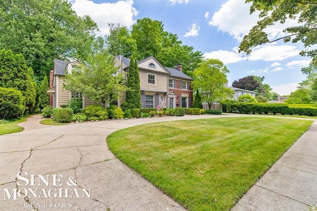 28 Hampton Rd, Grosse Pointe Shores, MI 48236 - view of front of property with a front yard and a chimney