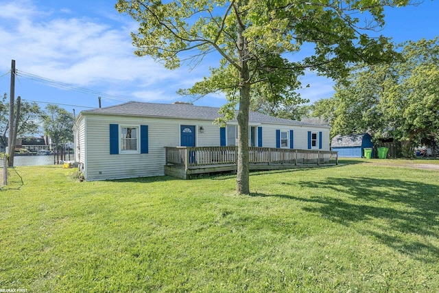 29738 N River Rd, Harrison Twp, MI 48045 - manufactured / mobile home with a deck, a front yard, and roof with shingles