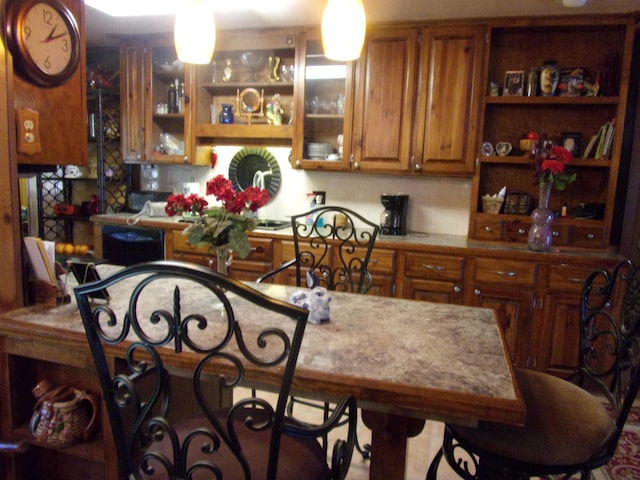 kitchen with dishwasher and decorative light fixtures