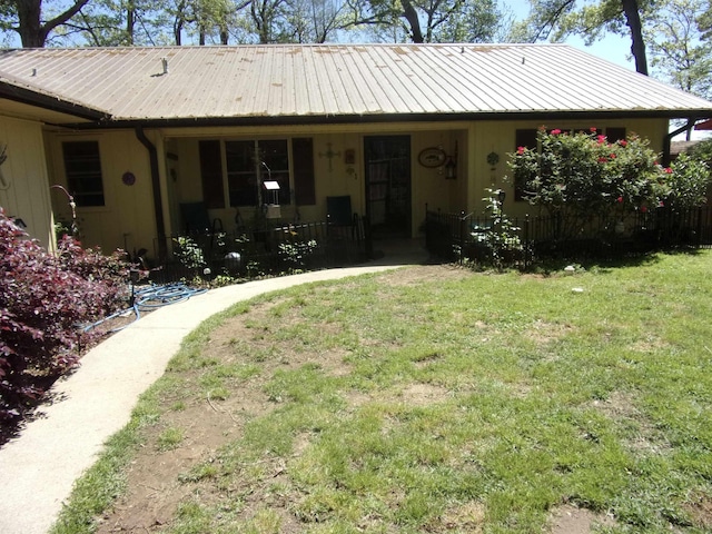 exterior space with a front yard