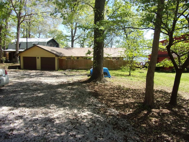 view of yard with a garage