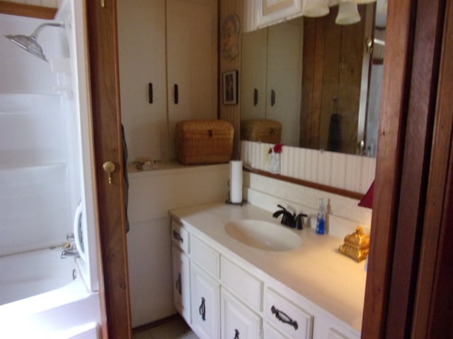 bathroom featuring vanity and tub / shower combination