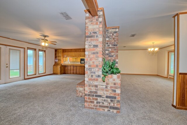 unfurnished living room featuring light colored carpet and ceiling fan with notable chandelier