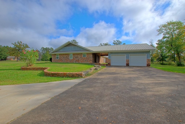 ranch-style home with a front yard and a garage