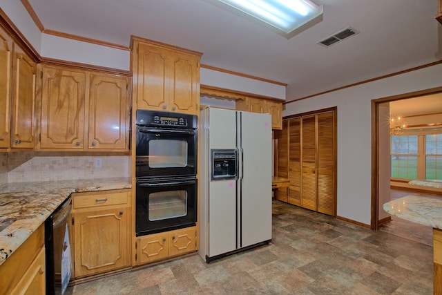 kitchen with an inviting chandelier, black appliances, ornamental molding, tasteful backsplash, and light stone counters