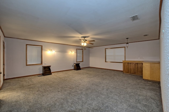 unfurnished room with carpet flooring and ceiling fan