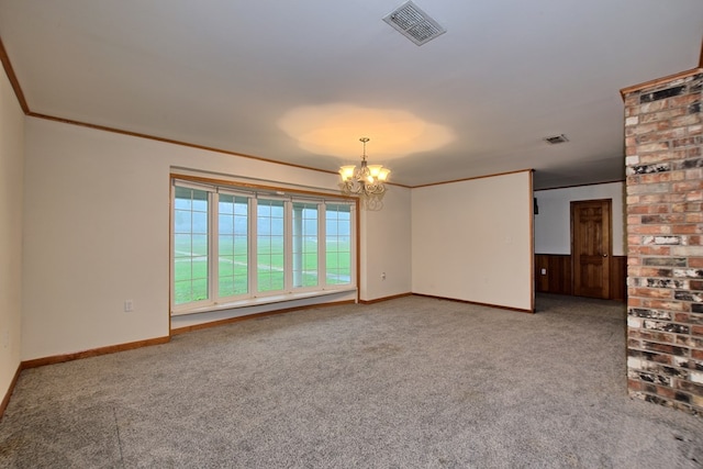 carpeted empty room with crown molding and a chandelier