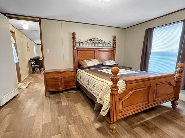 228 Blue Jay Dr, Brookeland, TX 75931 - bedroom with crown molding and wood finished floors