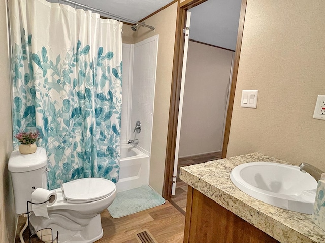 228 Blue Jay Dr, Brookeland, TX 75931 - bathroom with shower / bath combo, visible vents, ornamental molding, toilet, and wood finished floors