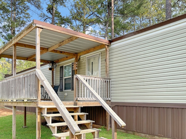 228 Blue Jay Dr, Brookeland, TX 75931 - wooden deck featuring stairway and a yard
