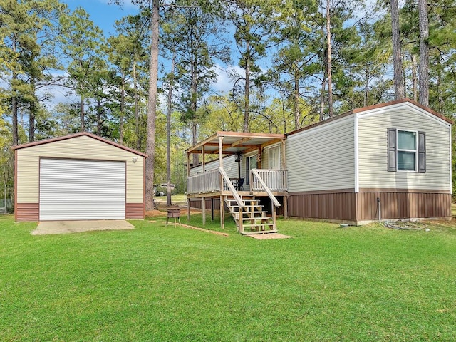 228 Blue Jay Dr, Brookeland, TX 75931 - view of yard featuring stairs, a deck, a detached garage, and an outdoor structure