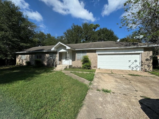 ranch-style home featuring a garage and a front lawn