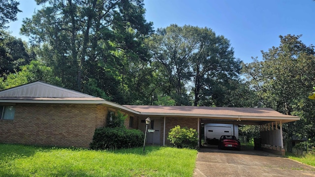 ranch-style home featuring a carport