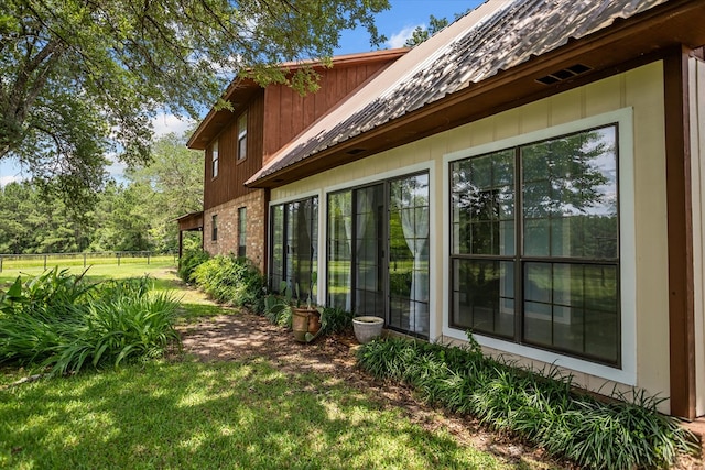 463 Allen Dr, Pollok, TX 75969 - view of side of property with a metal roof and brick siding