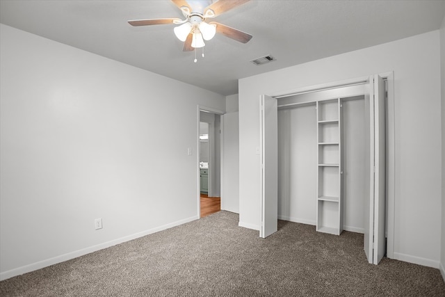 463 Allen Dr, Pollok, TX 75969 - unfurnished bedroom featuring carpet, a closet, and a ceiling fan