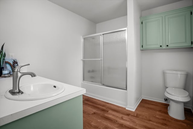 463 Allen Dr, Pollok, TX 75969 - bathroom with enclosed tub / shower combo, wood finished floors, and vanity