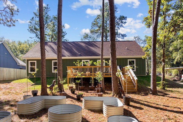 back of property featuring a deck