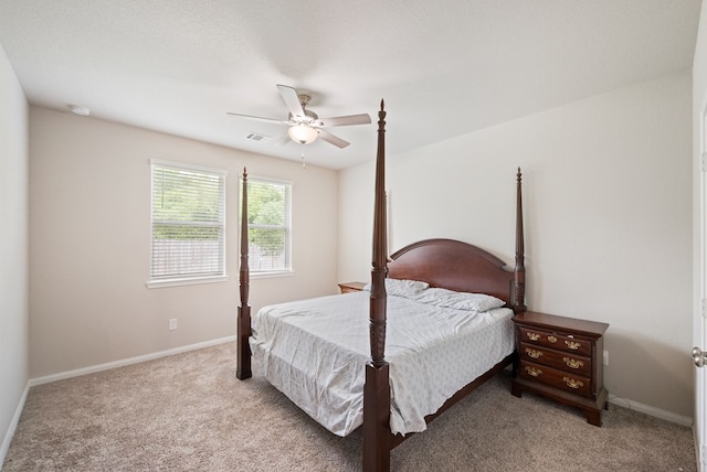 bedroom with baseboards, ceiling fan, and light colored carpet